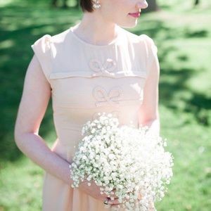 Peach dress with bow details